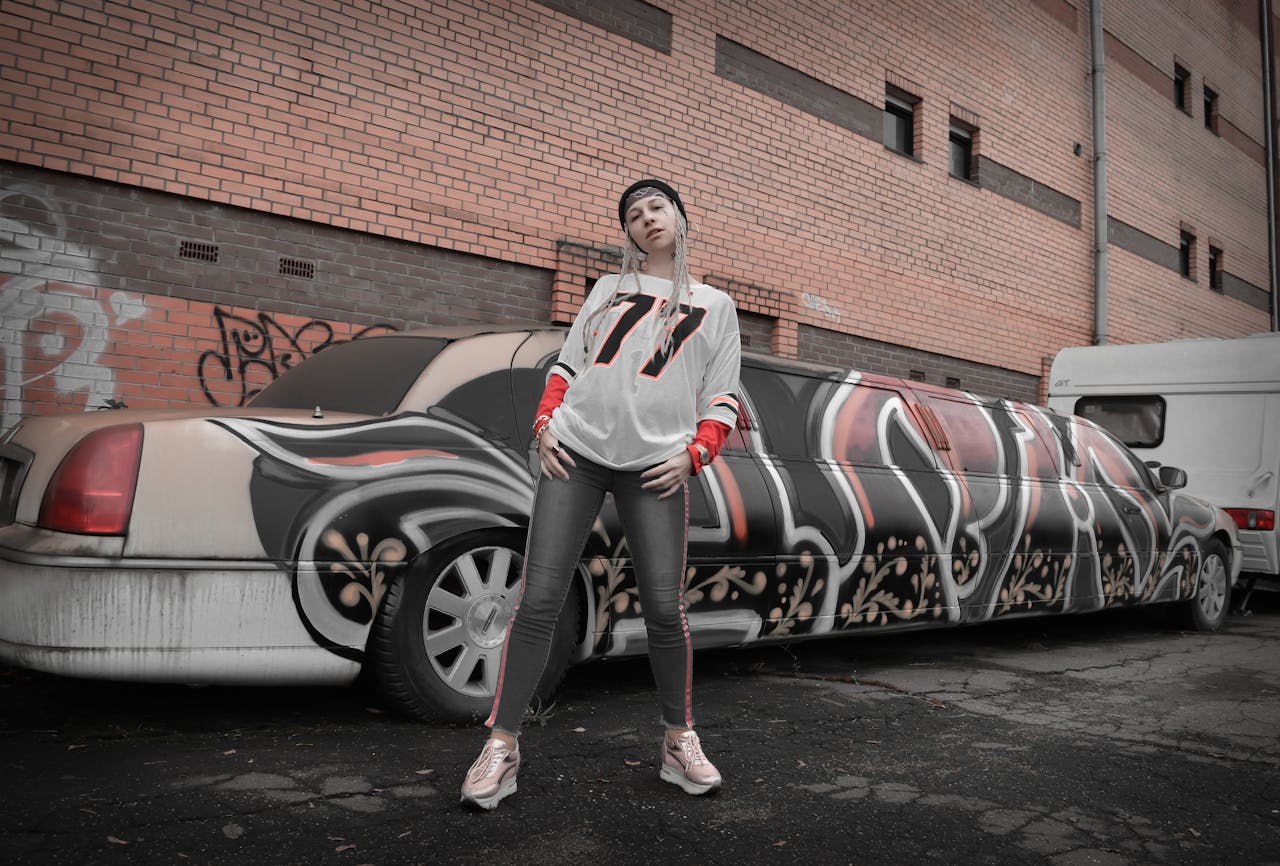 A Woman in White and Red Long Sleeves Posing at the Camera